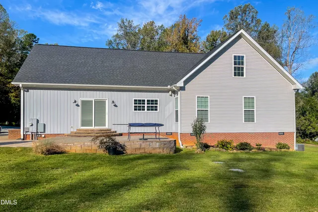 a bedroom with a bed and a television