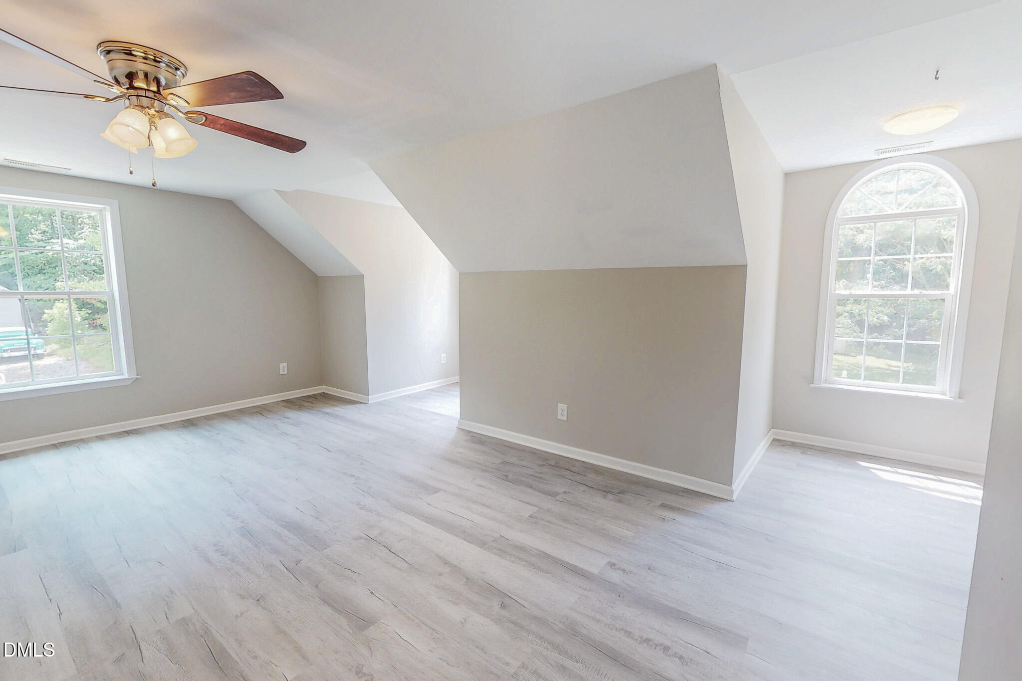 125 Al Gray Road Timberlake, NC 27583 - Photo 45 of 61 an empty room with wooden floor chandelier fan and windows
