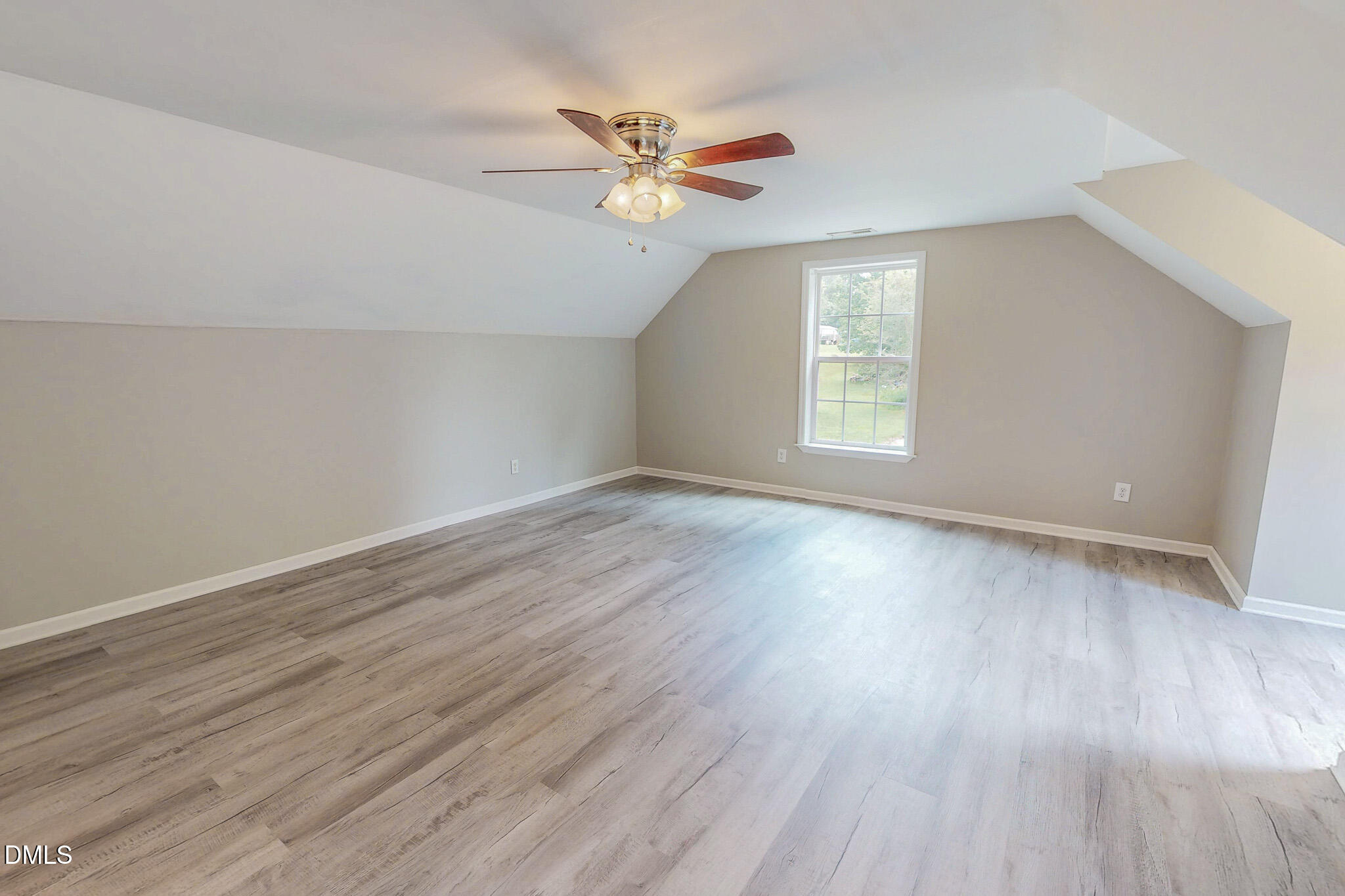 125 Al Gray Road Timberlake, NC 27583 - Photo 49 of 61 an empty room with wooden floor and windows