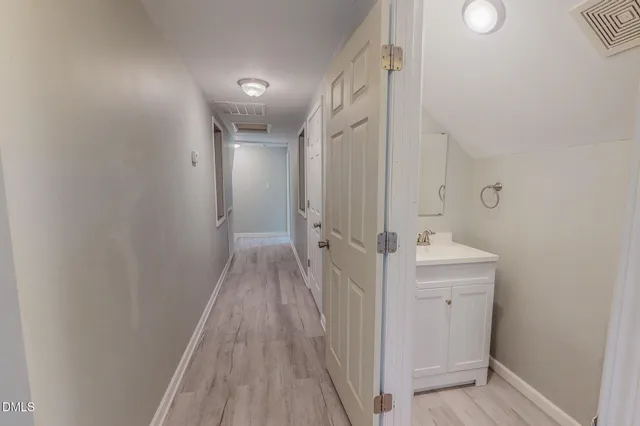 a view of room with furniture and a potted plant