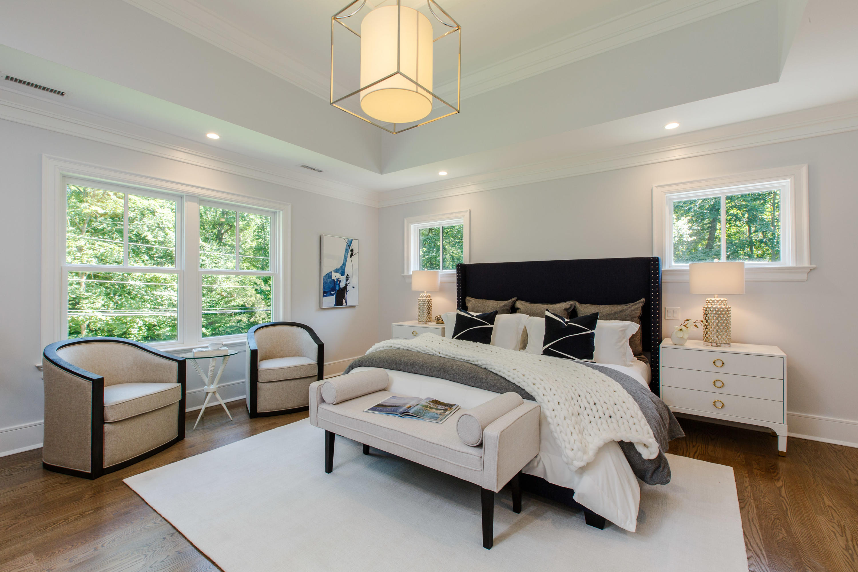 72 Deepwood Road Darien, CT 06820 - Photo 24 of 39 a bedroom with a bed and a chandelier