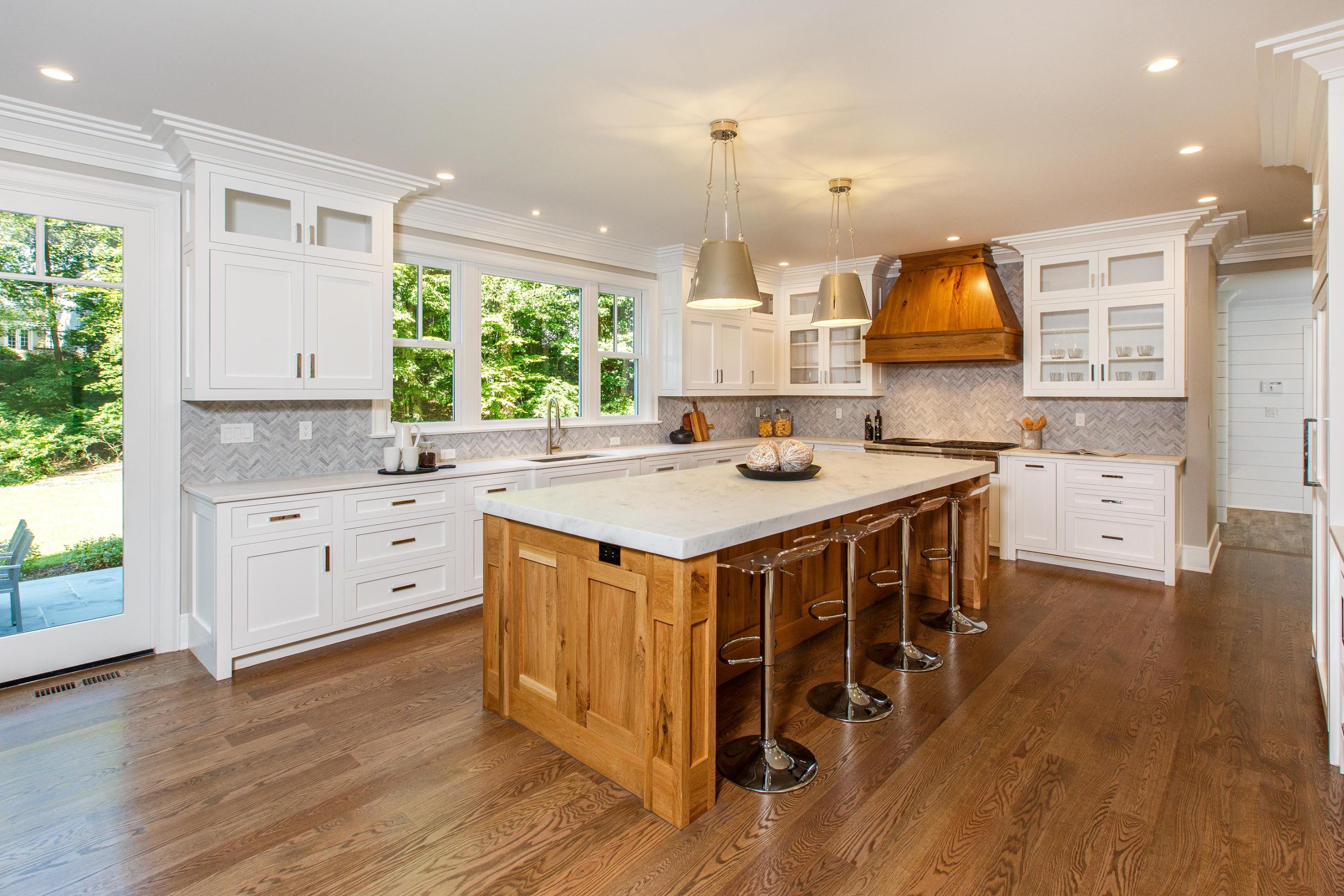 72 Deepwood Road Darien, CT 06820 - Photo 3 of 39 a kitchen with stainless steel appliances a kitchen island hardwood floor sink stove and wooden cabinets