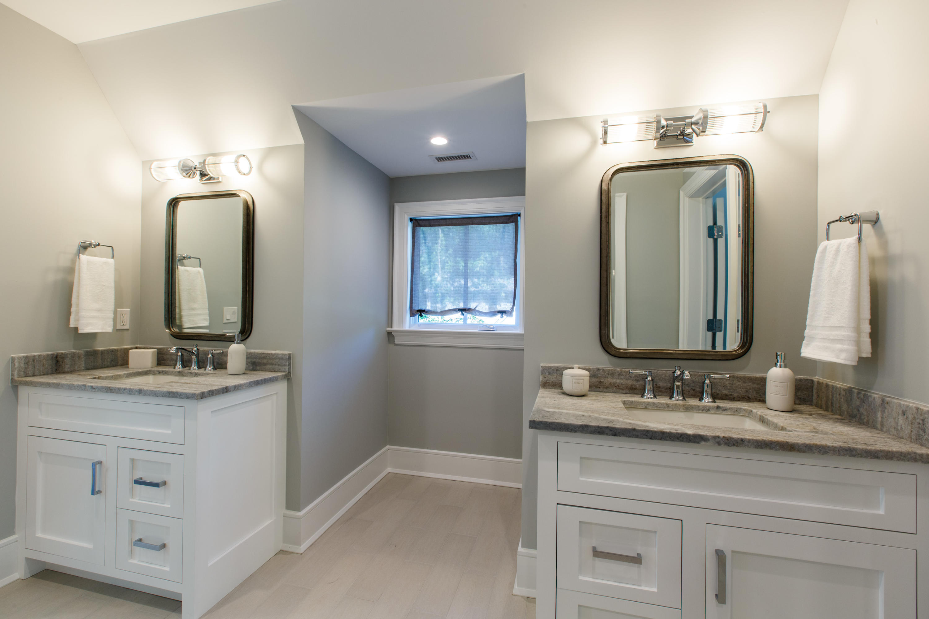 72 Deepwood Road Darien, CT 06820 - Photo 31 of 39 a bathroom with double vanity sinks and a mirror