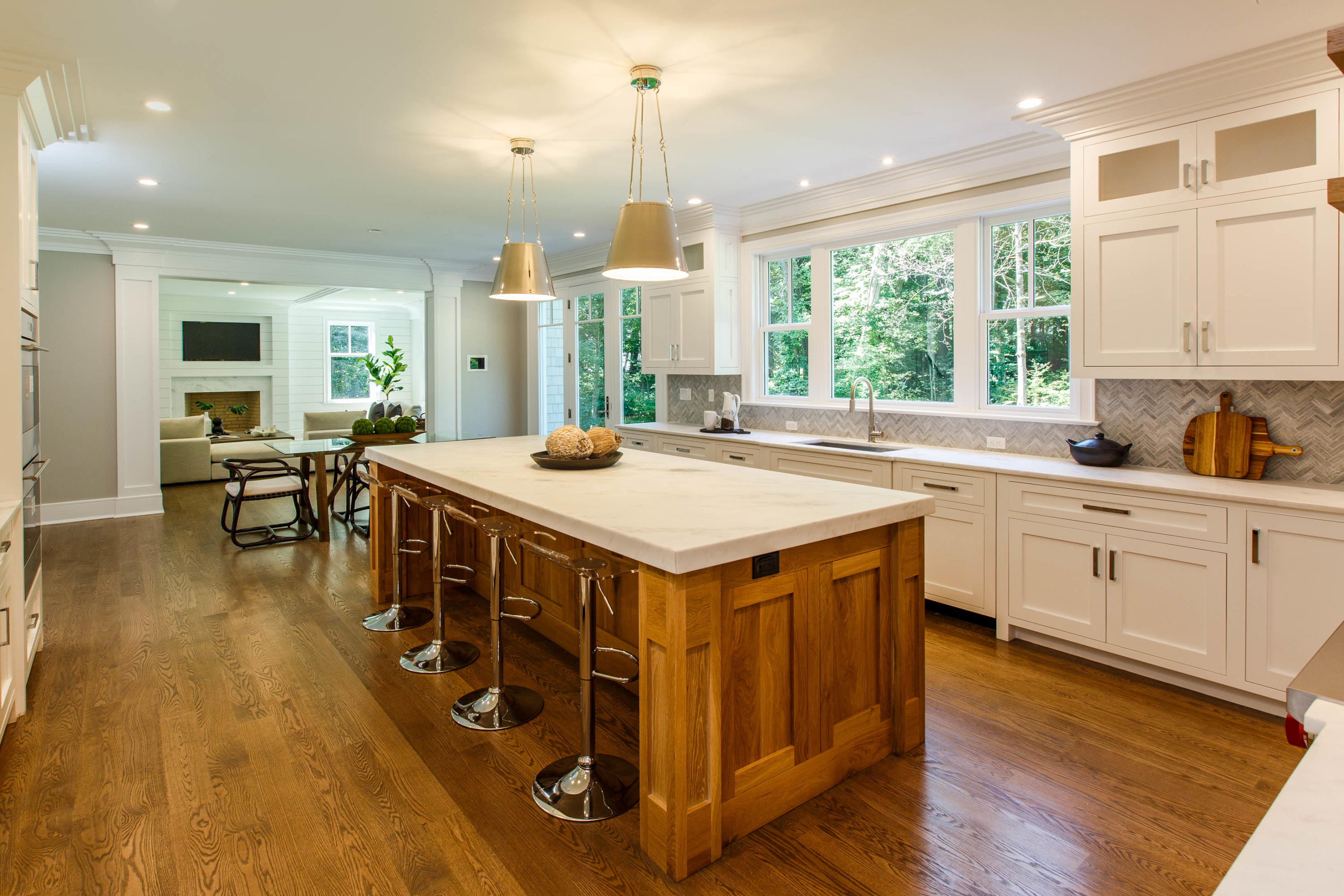 72 Deepwood Road Darien, CT 06820 - Photo 6 of 39 a kitchen with a stove a sink a dining table and chairs