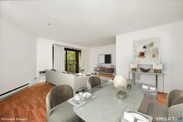 a living room with furniture window and a flat screen tv