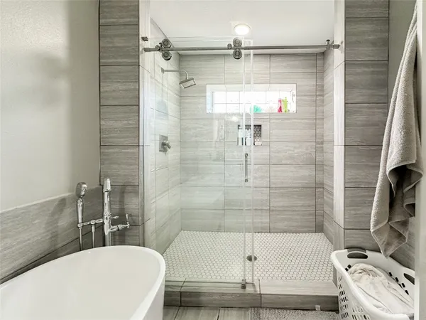 a bedroom with a bed and a couch