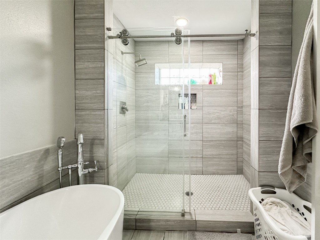 19310 Enchanted Oaks Drive Spring, TX 77388 - Photo 19 of 49 a bathroom with a sink a toilet and shower