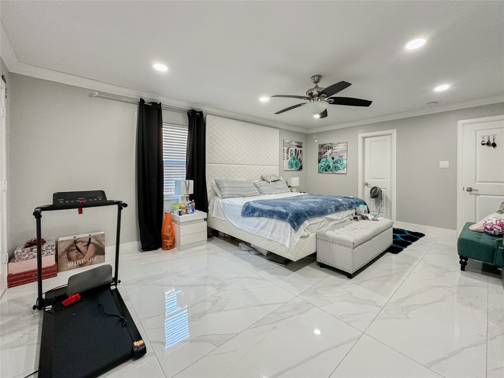 19310 Enchanted Oaks Drive Spring, TX 77388 - Photo 20 of 49 a bedroom with a bed and a couch
