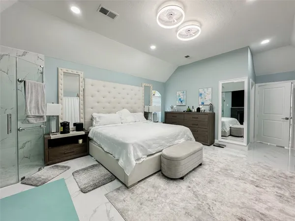 a view of walk in closet and cabinet