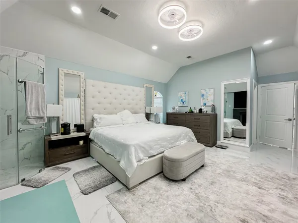 a view of walk in closet and bedroom