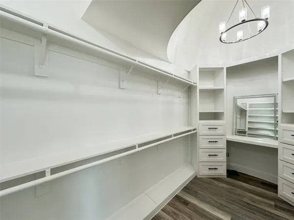 a bathroom with a sink mirror vanity and toilet