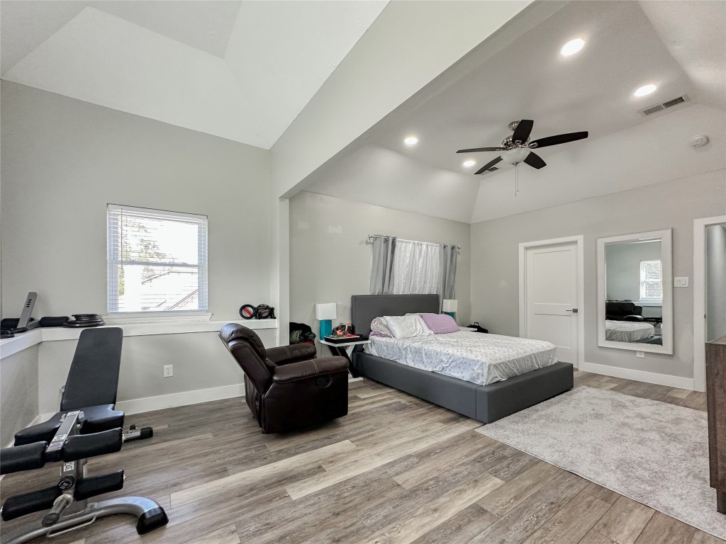 19310 Enchanted Oaks Drive Spring, TX 77388 - Photo 27 of 49 a living room with a bed furniture and a flat screen tv