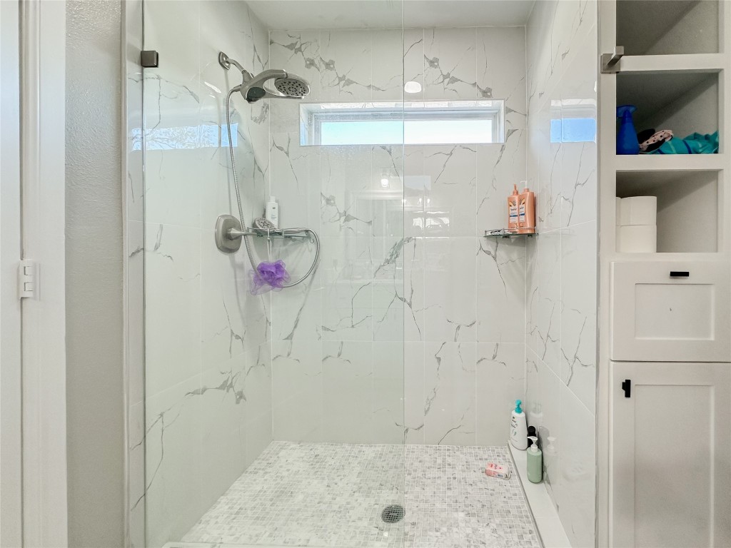 19310 Enchanted Oaks Drive Spring, TX 77388 - Photo 28 of 49 a bathroom with a shower