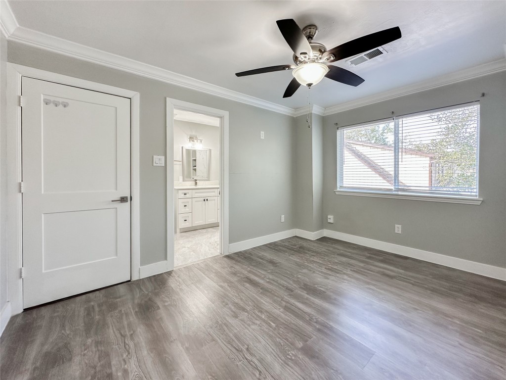 19310 Enchanted Oaks Drive Spring, TX 77388 - Photo 30 of 49 a view of an empty room with wooden floor and a window