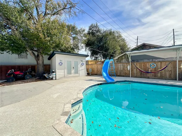 a view of a backyard with a slide