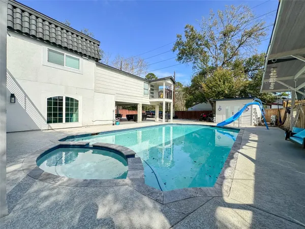 a view of a house with a swimming pool