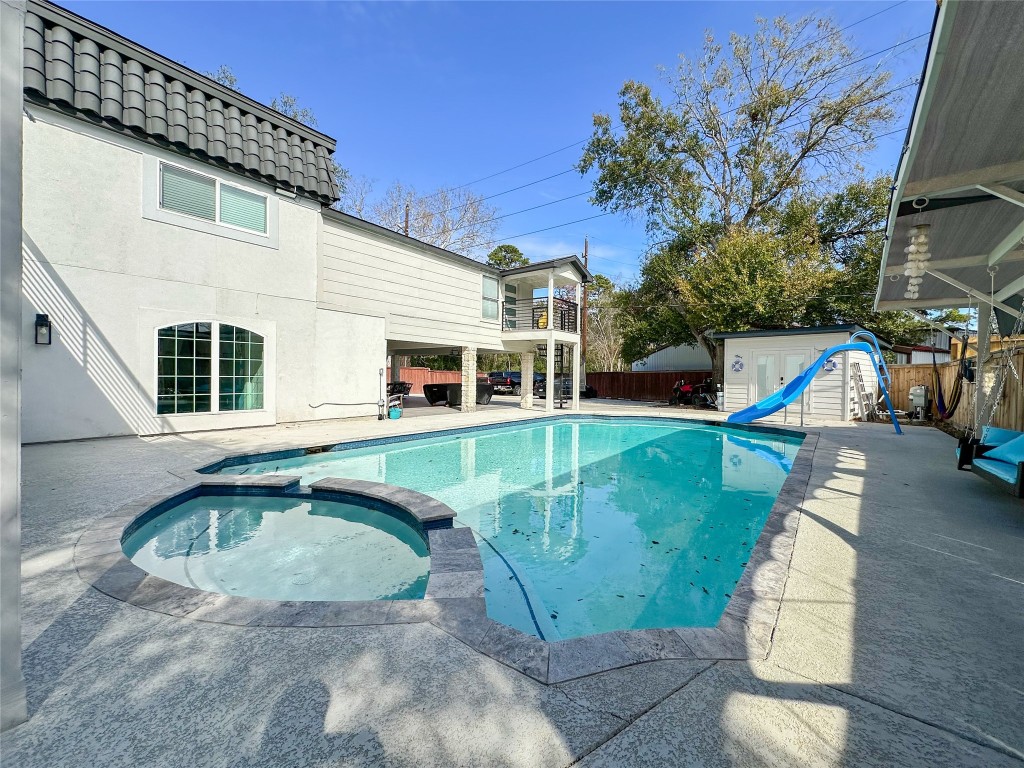 19310 Enchanted Oaks Drive Spring, TX 77388 - Photo 6 of 49 a view of a house with a swimming pool