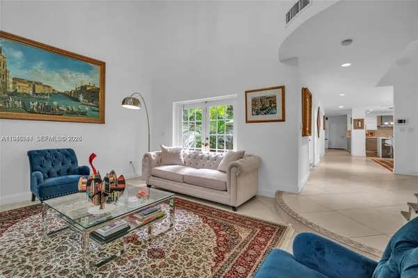 a living room with furniture and a rug