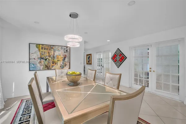 a view of a dining room with furniture wooden floor and a rug