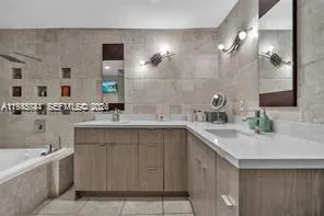 a bathroom with a sink double vanity and a mirror