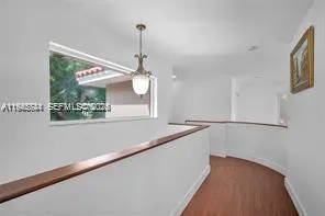 a view of a hallway with a chandelier