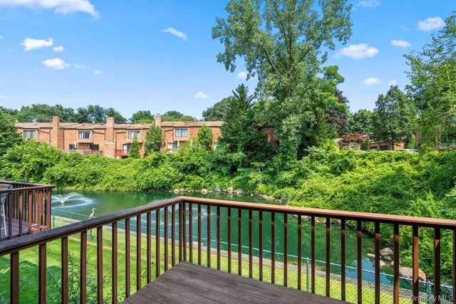 a balcony with trees in front of it