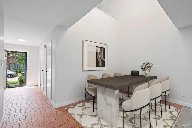 a dining room with a table and chairs