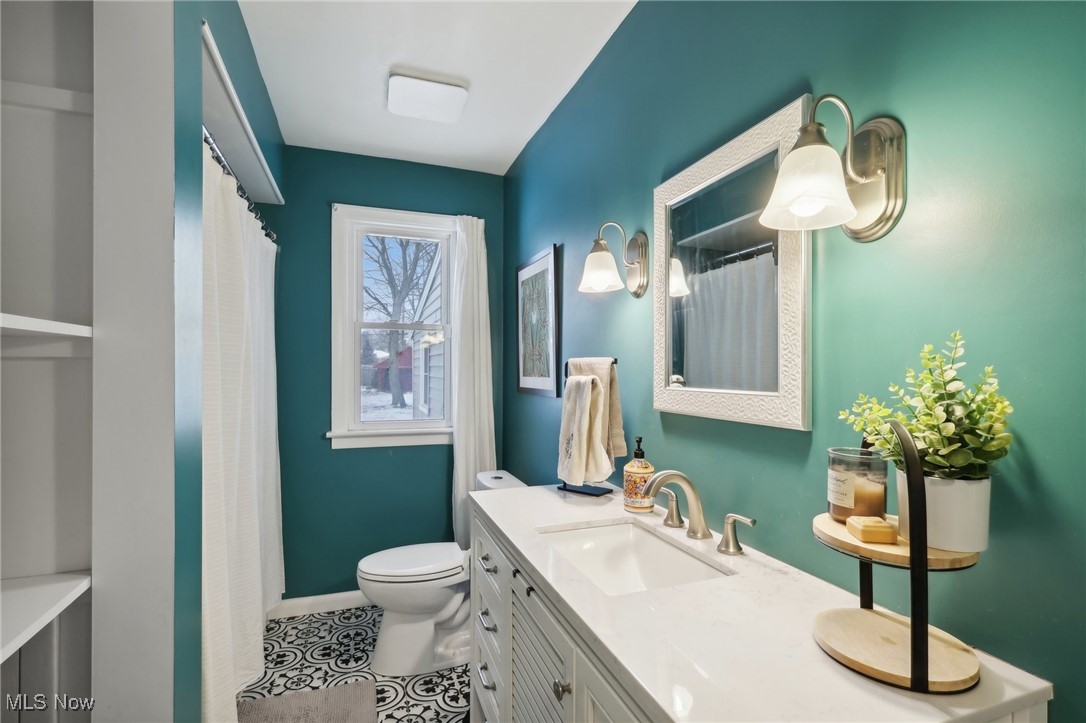 6086 Crossview Road Independence, OH 44131 - Photo 18 of 44 Bathroom featuring toilet, vanity, and tile patterned floors