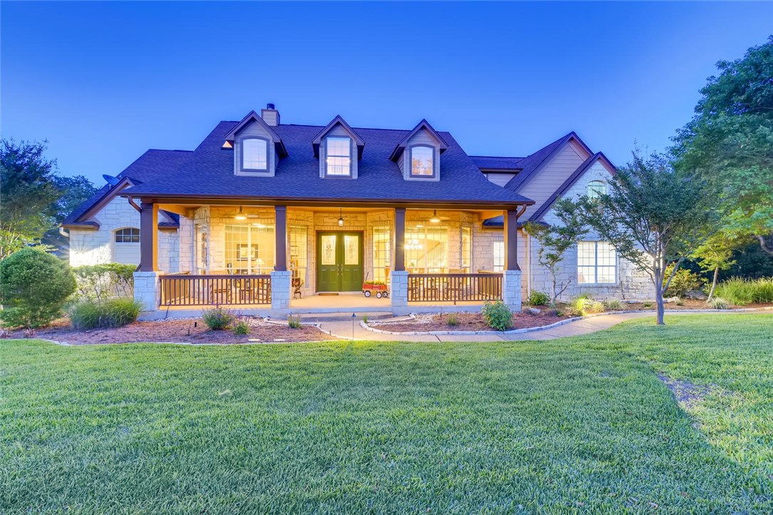601 Riders Trail Austin, TX 78733 - Photo 1 of 1 a view of a house with a big yard and a large tree