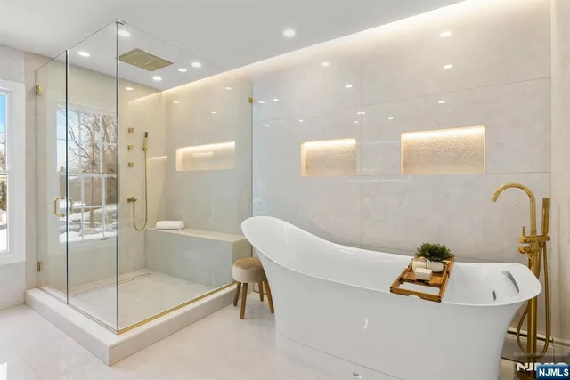 a bathroom with a bathtub and a shower