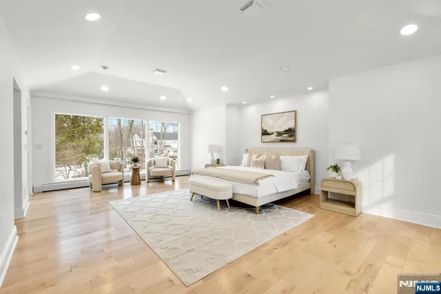 a living room with furniture and large window