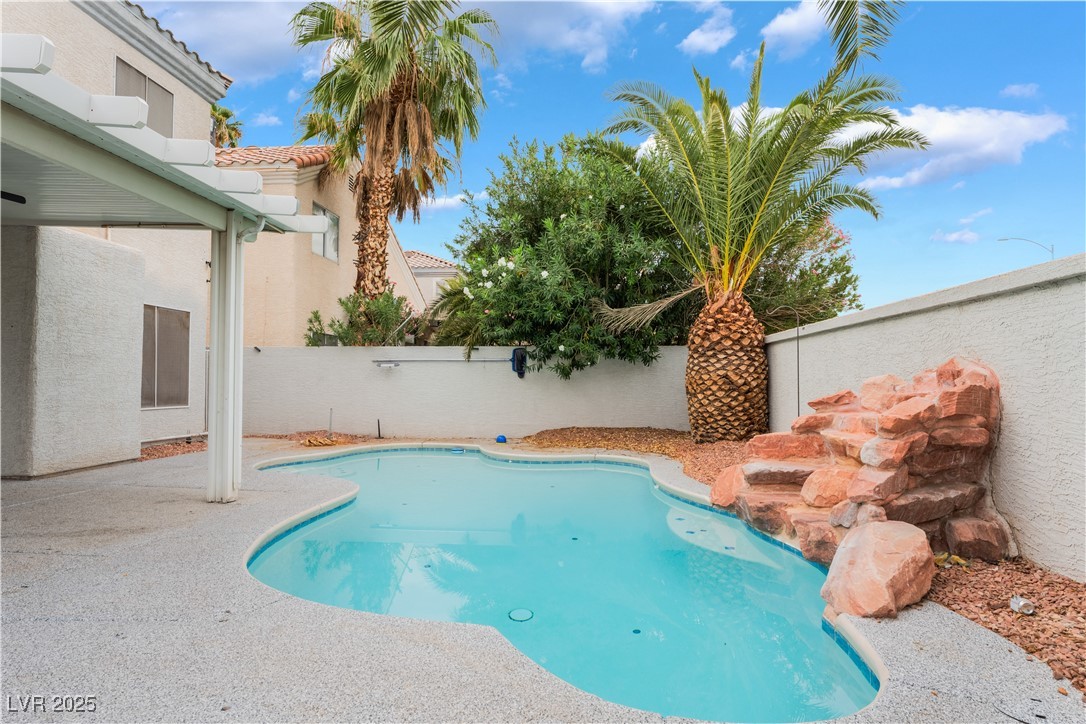 3695 Funston Way Las Vegas, NV 89129 - Photo 41 of 43 View of swimming pool featuring a fenced backyard and a patio