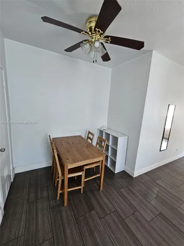 a room with wooden floor and staircase