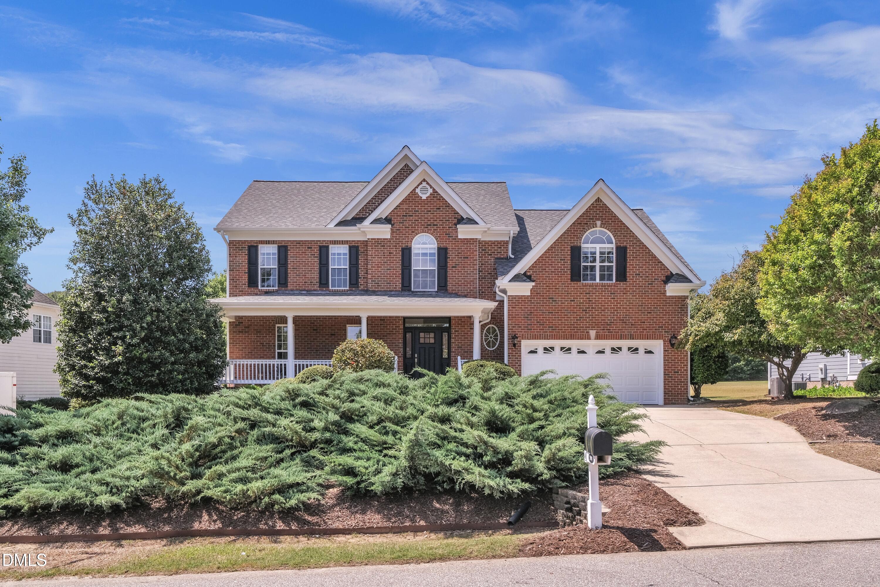 2908 Oak Bridge Drive Raleigh, NC 27610 - Photo 2 of 47 a front view of a house with a yard