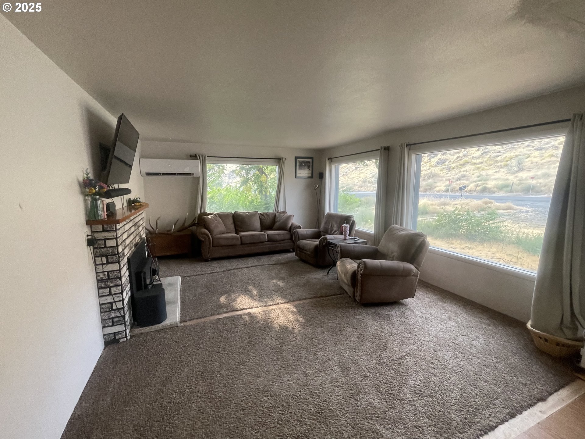 62886 Highway 74 Ione, OR 97843 - Photo 4 of 15 a living room with furniture and a large window
