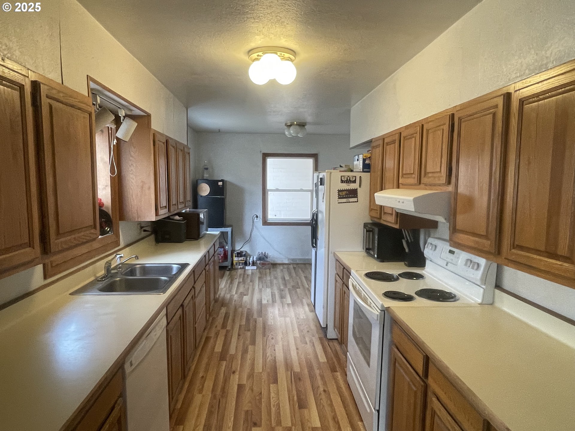 62886 Highway 74 Ione, OR 97843 - Photo 6 of 15 a kitchen that has a sink cabinets counter space and appliances