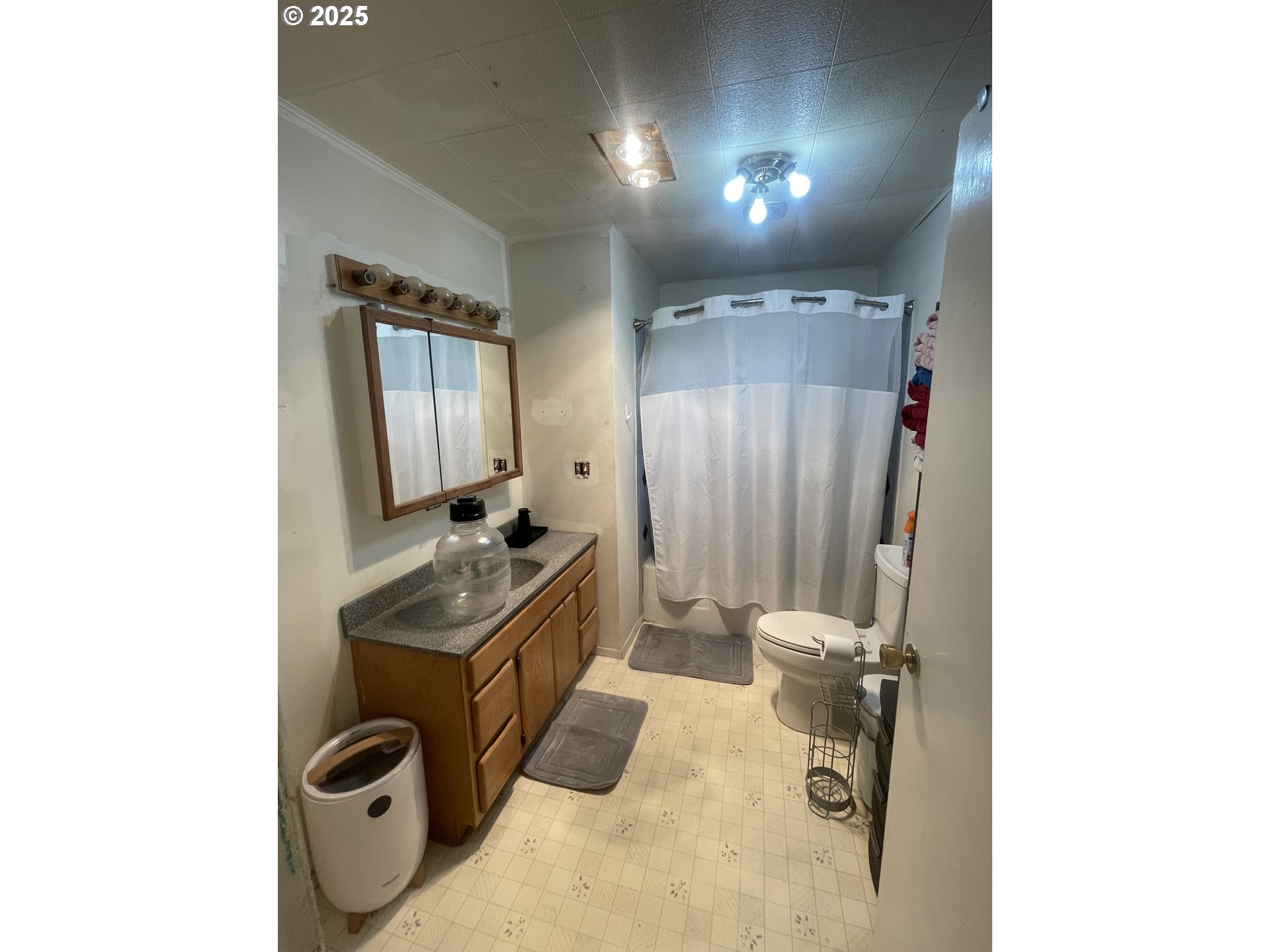 62886 Highway 74 Ione, OR 97843 - Photo 9 of 15 a bathroom with a sink toilet and mirror