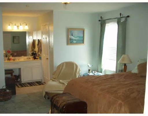 a bedroom with a bed room view and a window