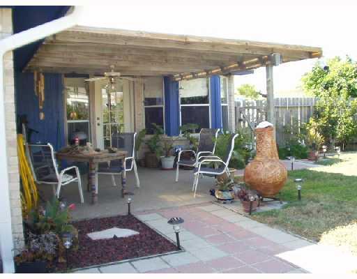 15258 Capstan Street Corpus Christi, TX 78418 - Photo 6 of 7 a view of a patio with table and chairs and potted plants