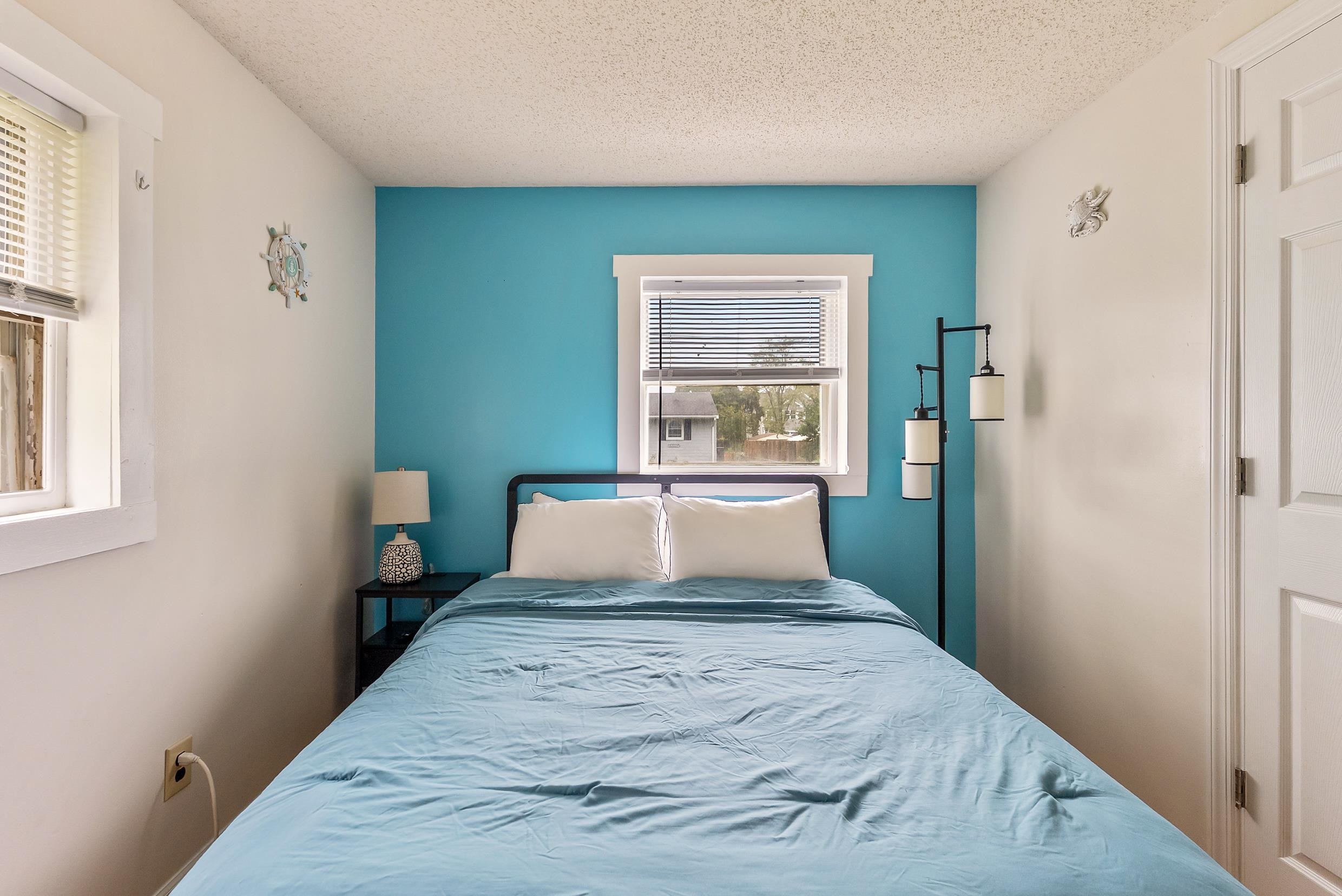 213 Langs Avenue Villas, NJ 08251 - Photo 15 of 20 a bedroom with a bed and window