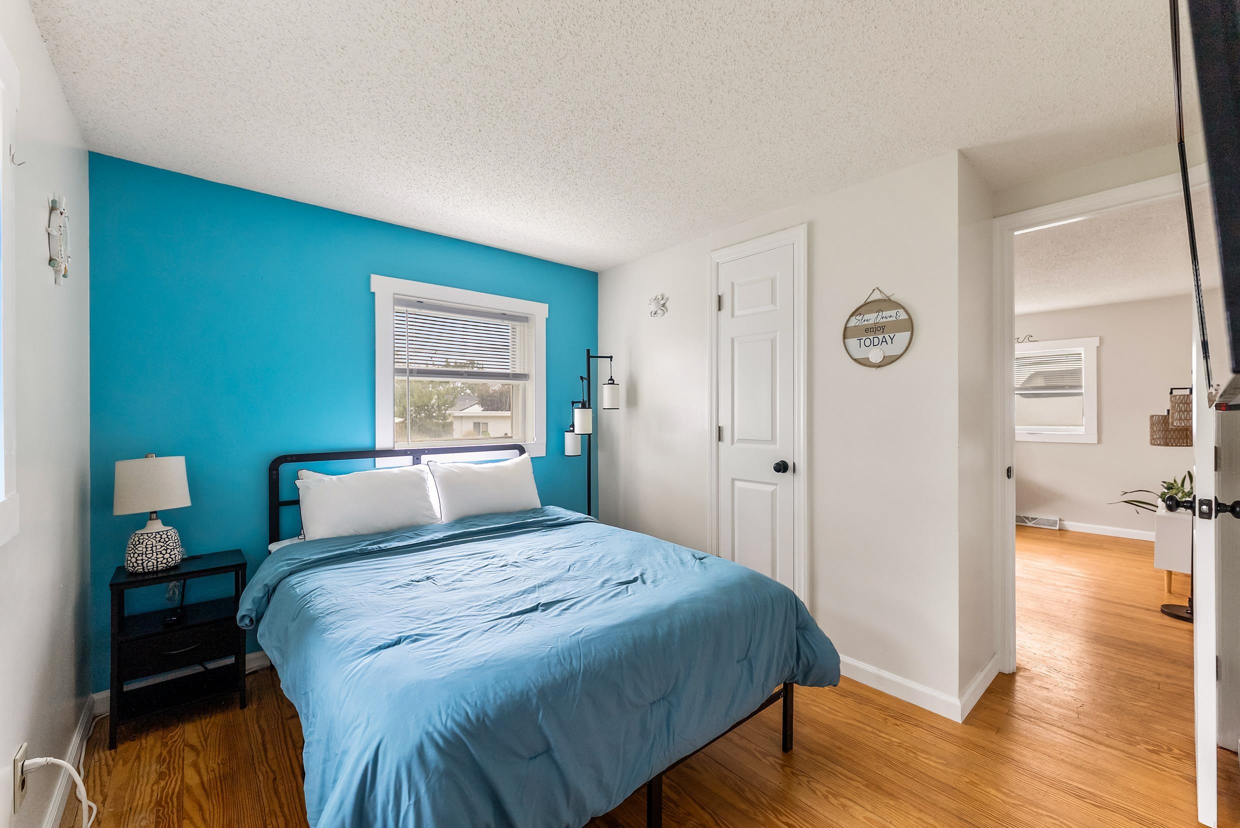 213 Langs Avenue Villas, NJ 08251 - Photo 16 of 20 a bedroom with a bed and wooden floor