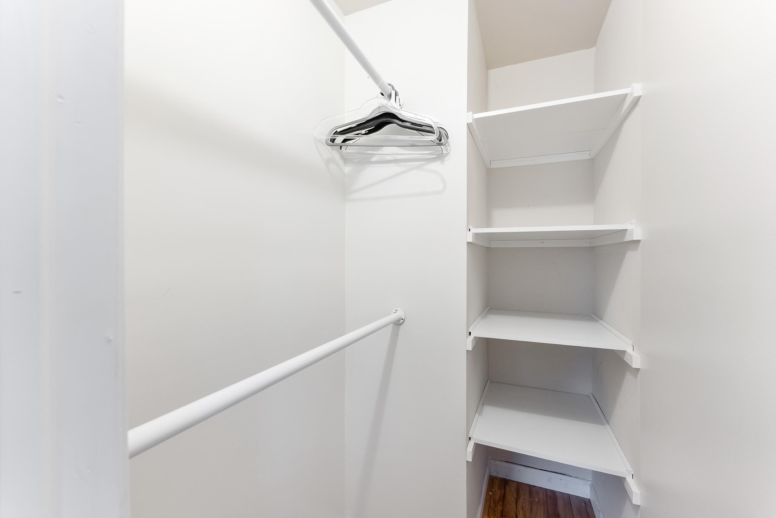 213 Langs Avenue Villas, NJ 08251 - Photo 17 of 20 a utility room with linen closet and empty racks