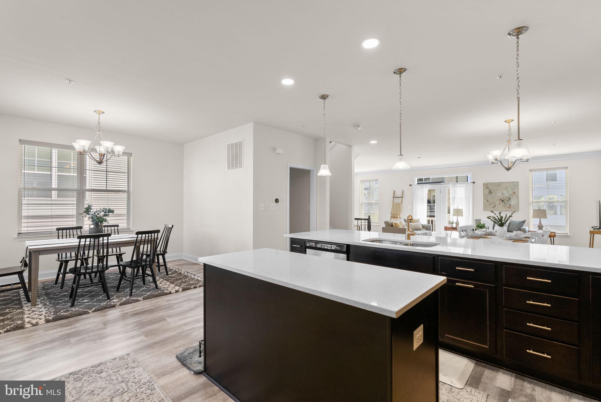 2 Hanover Road Reisterstown, MD 21136 - Photo 11 of 30 a kitchen with a dining table chairs sink and cabinets