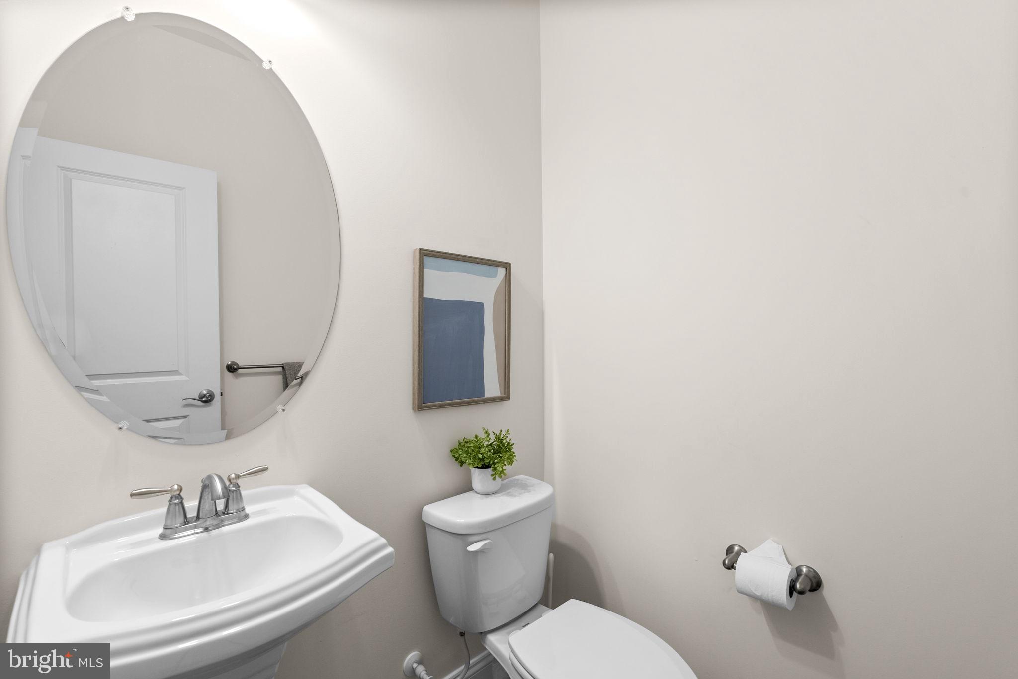 2 Hanover Road Reisterstown, MD 21136 - Photo 13 of 30 a bathroom with a sink mirror and toilet