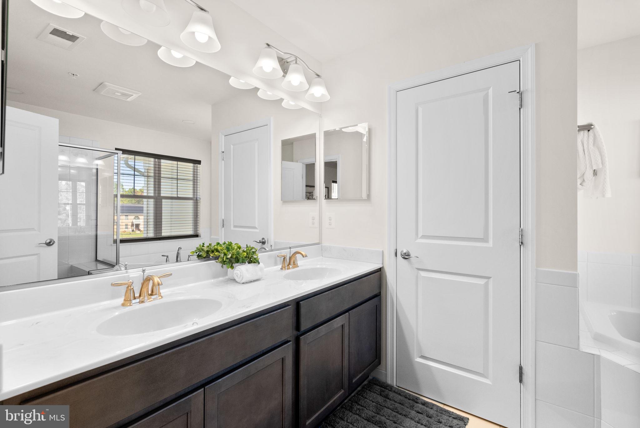 2 Hanover Road Reisterstown, MD 21136 - Photo 17 of 30 a bathroom with a double vanity sink and a mirror