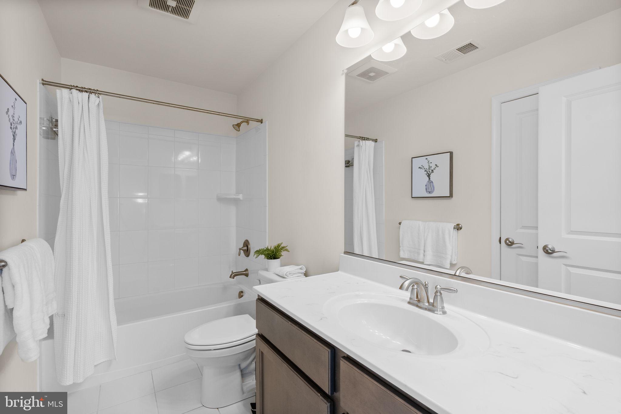 2 Hanover Road Reisterstown, MD 21136 - Photo 22 of 30 a bathroom with a sink a toilet and shower