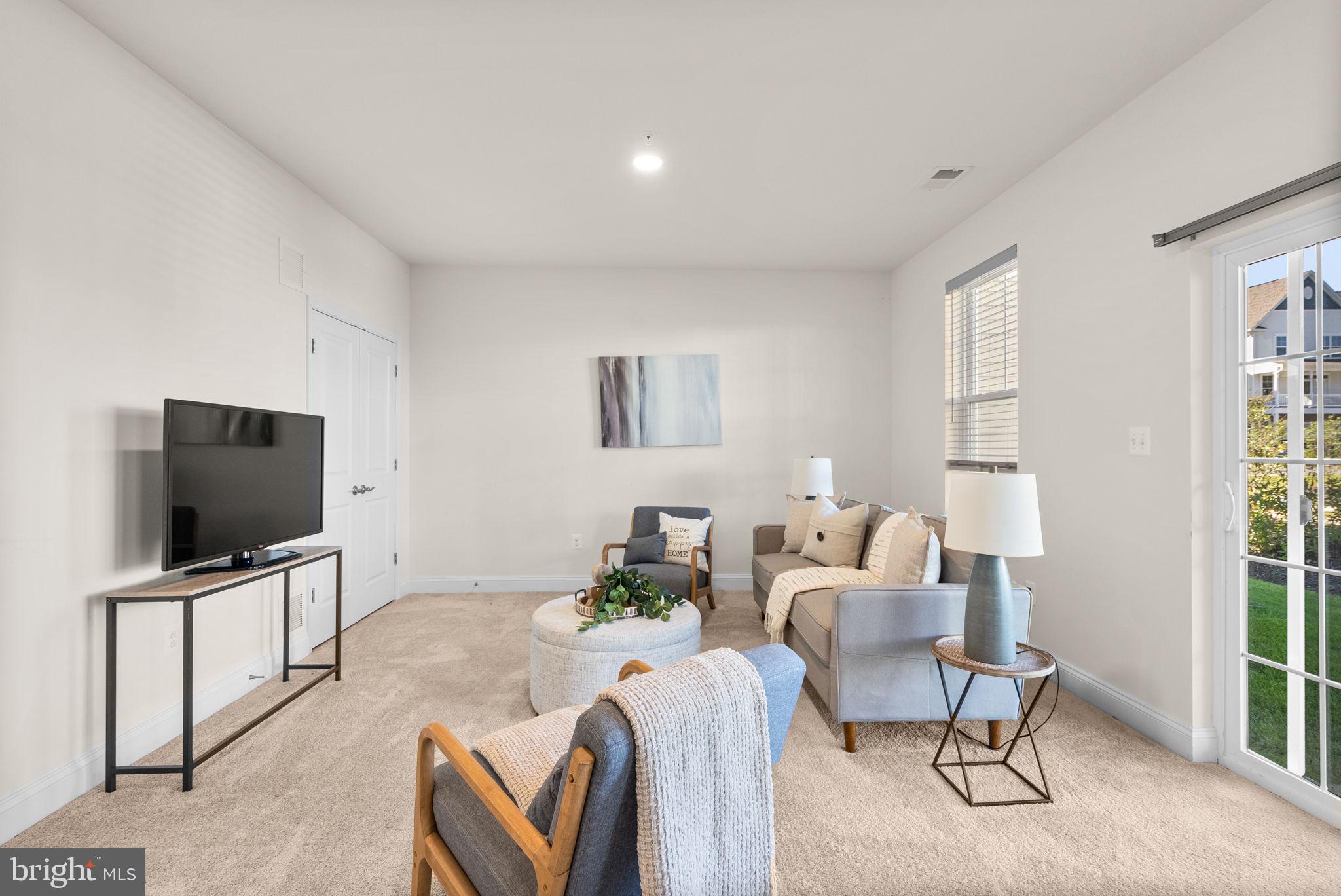 2 Hanover Road Reisterstown, MD 21136 - Photo 23 of 30 a living room with furniture and a flat screen tv