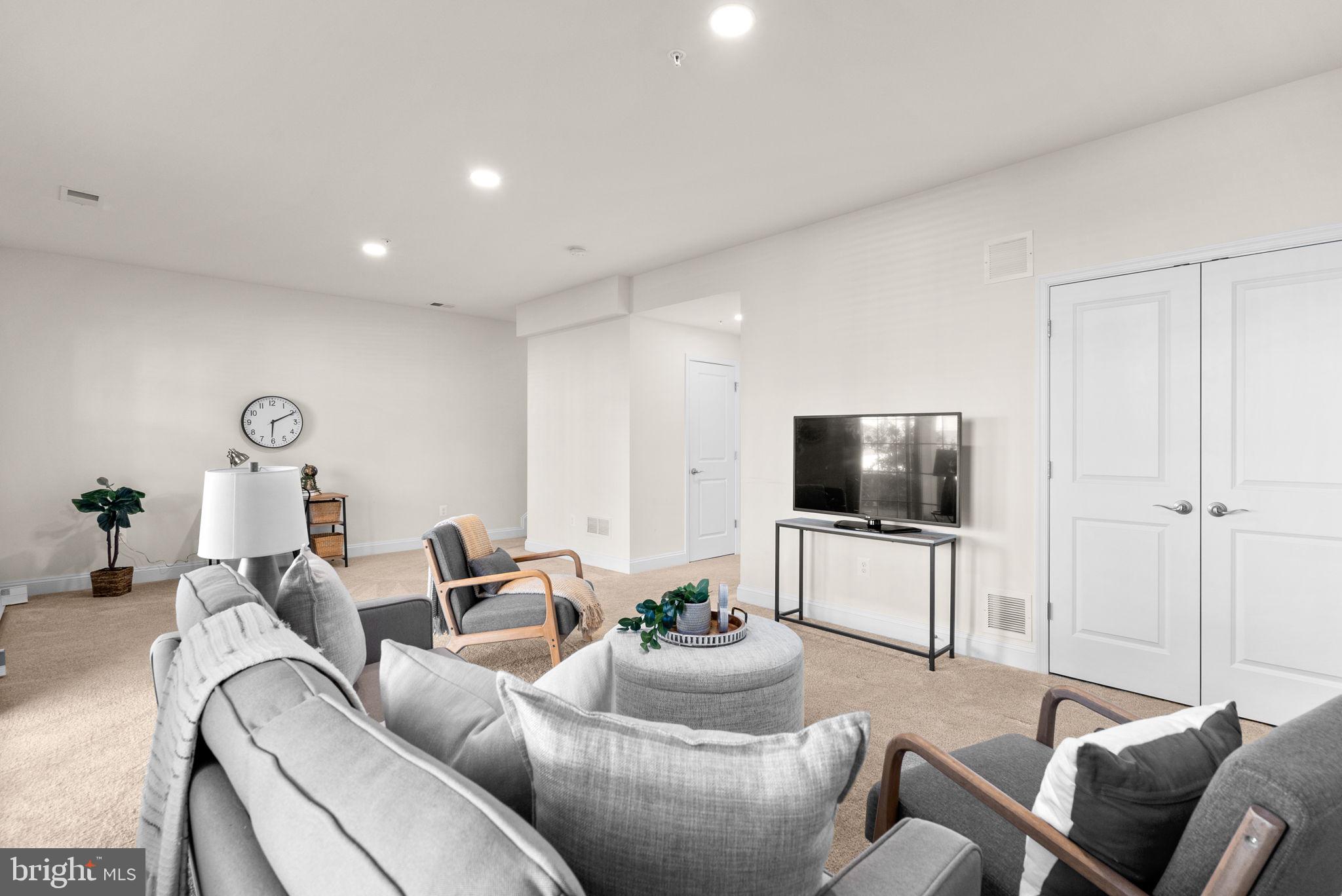 2 Hanover Road Reisterstown, MD 21136 - Photo 25 of 30 a living room with furniture and a flat screen tv