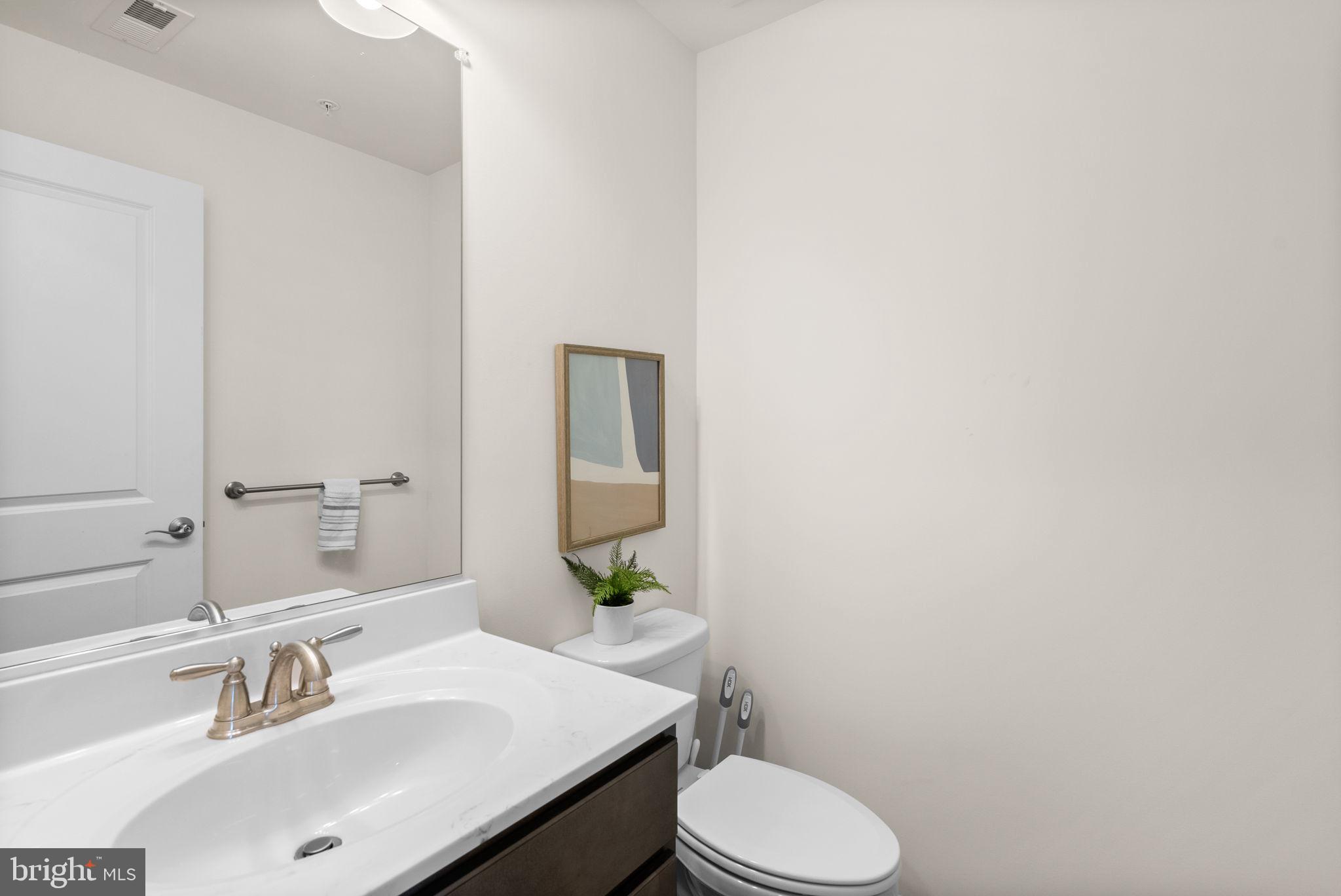 2 Hanover Road Reisterstown, MD 21136 - Photo 26 of 30 a bathroom with a sink and a mirror with toilet