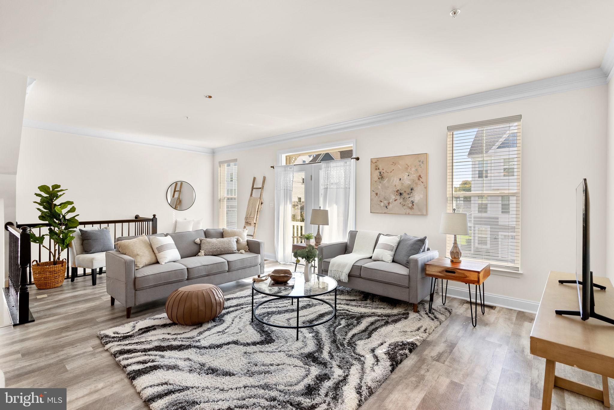 2 Hanover Road Reisterstown, MD 21136 - Photo 3 of 30 a living room with furniture large windows and wooden floor